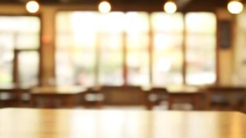 Inviting Atmosphere A blurred image of a cozy cafe interior with warm lighting and wooden tables photo