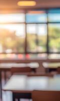 Blurred classroom interior with abundant natural light enhancing spacious learning ambiance photo