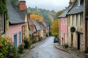 Gold Hill in Shaftesbury, Dorset, showing colorful houses on a rainy autumn day photo