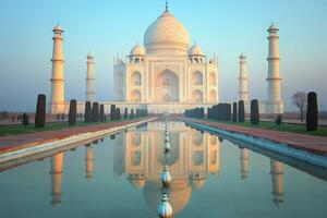 Taj Mahal reflecting in the water pool during sunrise in Agra, India photo