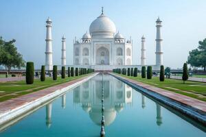 Taj Mahal reflecting in the water pool during a sunny day photo