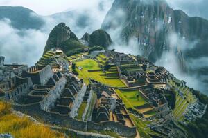 Machu Picchu emerging from the morning mist in the Andes Mountains photo
