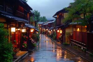 Wet pavement reflecting lights in Gion at dusk photo