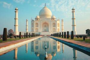 Taj Mahal reflecting in the water pond during a sunny day photo