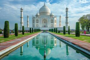 Taj Mahal reflecting in the water pool during a sunny day. photo