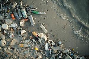 Plastic bottles and garbage polluting the seashore photo