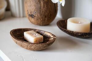 A natural soap dish made from a coconut shell photo