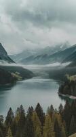 Beautiful misty and cloudy landscape with lake and mountns in summer natural colorful background traunsee lake in the austrian applause gmunden photo