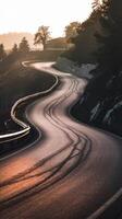 A winding road with curves and trees in the background photo
