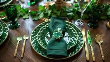 St. Patrick s Day table with green plates, gold cutlery, shamrocks photo