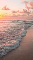 A beautiful sunset on the beach with waves and clouds photo