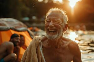 An older man is laughing while standing in the water photo