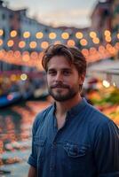 Man standing in front of a canal at night photo