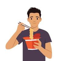 Young man enjoys eating noodles with chopsticks from a red takeout box. vector