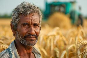 An old man standing in a field of wheat photo
