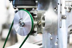 Close-up of mechanical pneumatic equipment elements in manufacturing equipment production photo