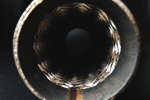 Close-up Selective focus picture with noise effect of exhaust pipe flexible connector photo
