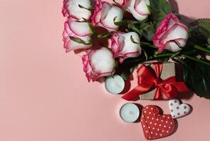 Mothers day. Red hearts and craft gifts On a sunny day on a white wooden background. Copy space. photo
