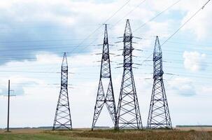 Silhouette High voltage electric tower On a sunny day on sunset time and sky on sunset time background. photo