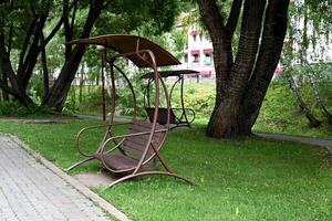 Wooden vintage bench in a public photo