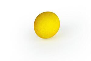 Vibrant yellow easter egg with glowing shell pattern, isolated on white background. Color contrast, creativity, holiday decoration, creativity, symbolism of rebirth. Copy space. Selective focus photo