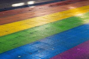 Vibrant rainbow colored path. Regenboogvlag on Grote Marktstraat in the Hague, Netherlands. Diversity, equality, inclusion, street art, and lgbtq pride concept. Copy space. Selective focus 2 photo