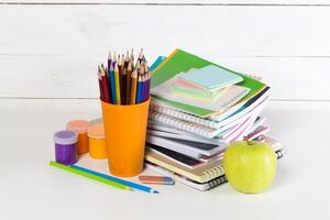 Front view of school supplies on white background photo