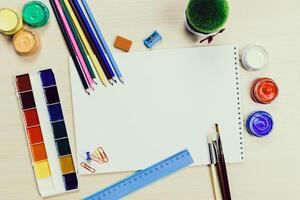 Creative workspace with art supplies and blank canvas ready for artistic expression in a home setting photo