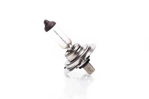 Close up of a light bulb on white background photo