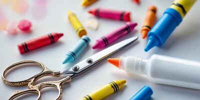 Crafting supplies on a table including scissors, crayons, and glue for creative activities at home photo