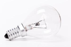 Close up of a light bulb on white background photo