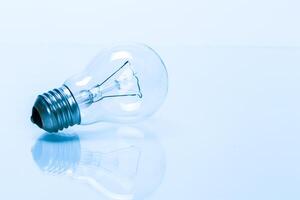 Close up of a light bulb on white background photo