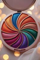 Colorful makeup palette with vibrant hues arranged in a spiral pattern, perfect for creative looks and artistic expression photo