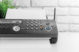 Fax machine close up in an office photo