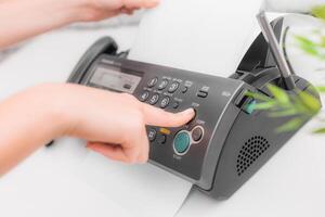 Fax machine close up in an office photo