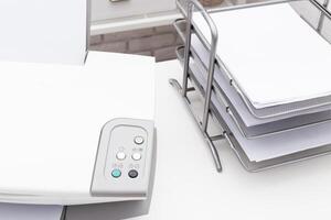 White printer on table close up in office photo