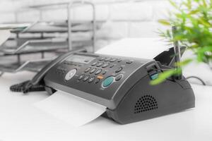 Fax machine close up in an office photo