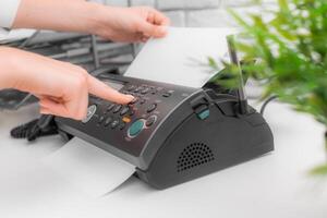 Fax machine close up in an office photo