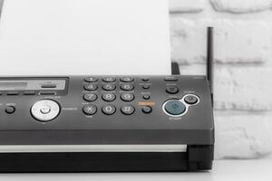 Black fax machine tool close up, business concept photo