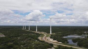 Several wind power tower in operation and a path close them video