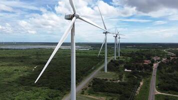 Several wind tower power in the forest and a cloudy sky generation renewable energy video