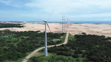 Wind power tower in operation in dunes video