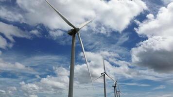 Several wind power tower with cloudy and blue sky in the background video