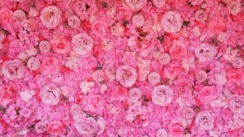 Bright pink floral wall decoration enhances atmosphere at event venue, Horizontal photo