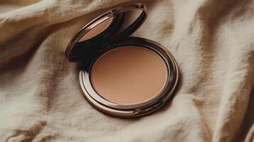 A compact powder compact on a bed photo