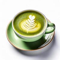 A vibrant green latte with artistic foam design in a cup. photo