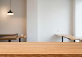 Empty table in a restaurant with white walls photo