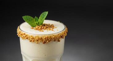 A glass of milk with a sprinkle of cinnamon photo