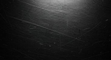 Black metal texture background with scratches and scratches photo