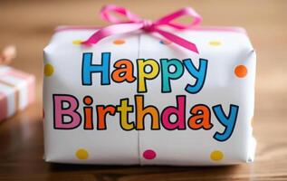 Happy birthday gift box with polka dot ribbon photo